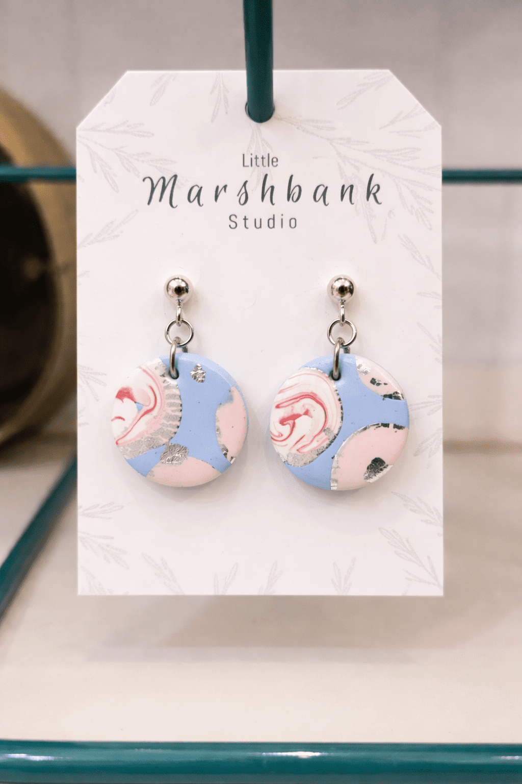 Statement Earrings displayed on white boutique stand in Grants Pass, Oregon | Rogue Sole & Style