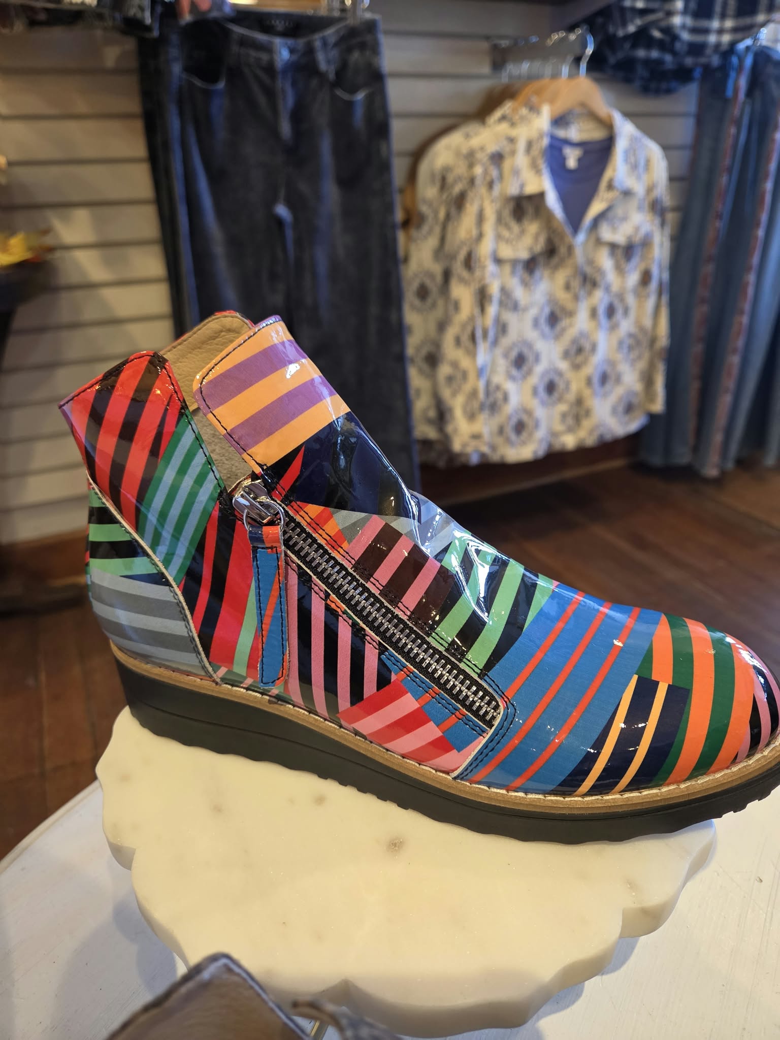 Colorful striped ankle boot displayed inside Rogue Sole & Style in Grants Pass, Oregon