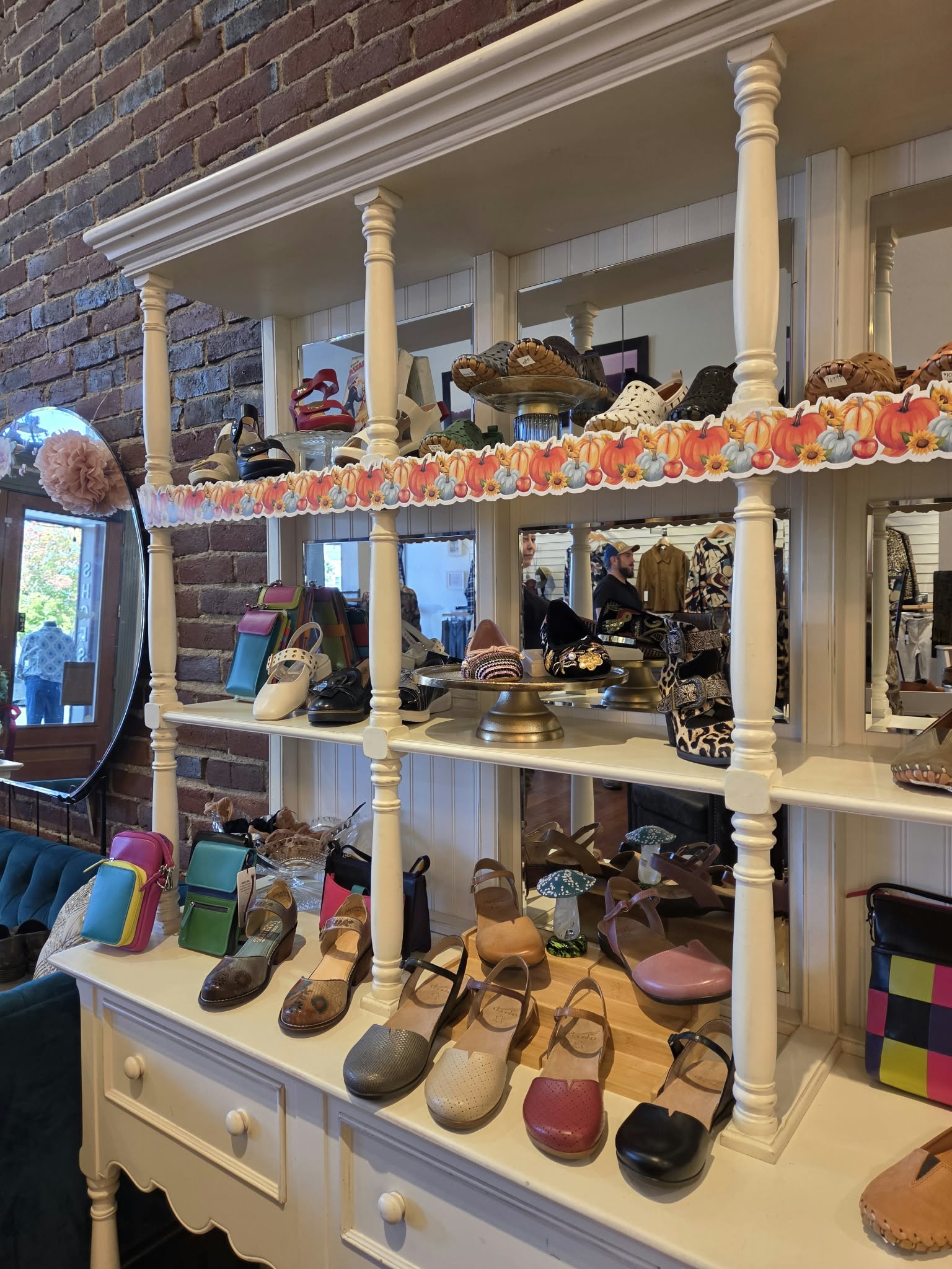 Women's shoes and colorful accessories displayed at Rogue Sole & Style in Grants Pass